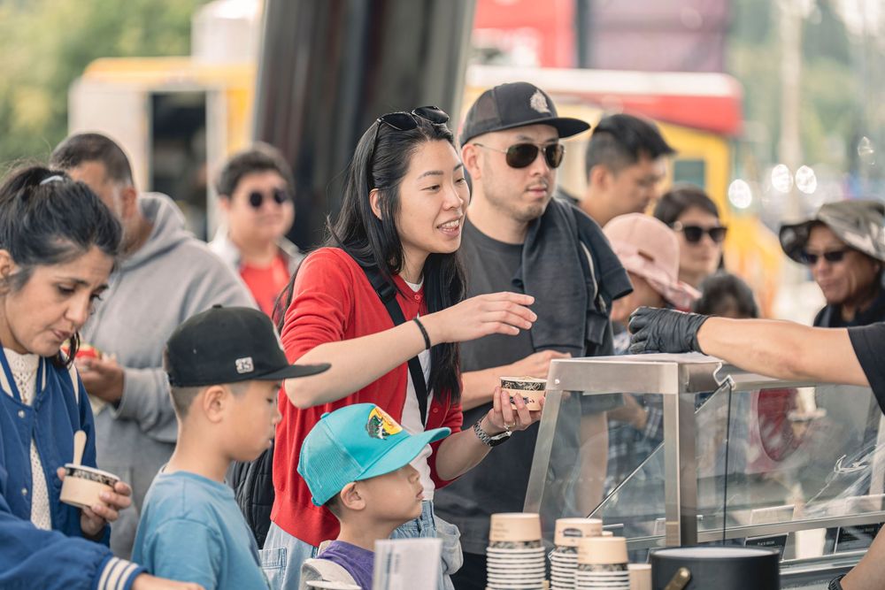 Family visiting a food stall at Canada Day