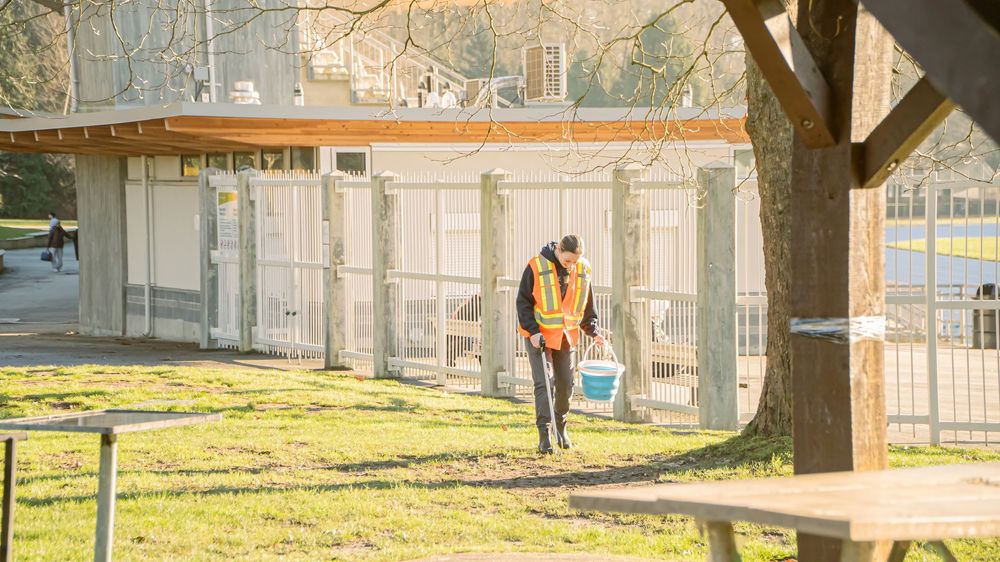 Volunteer collecting litter outdoors