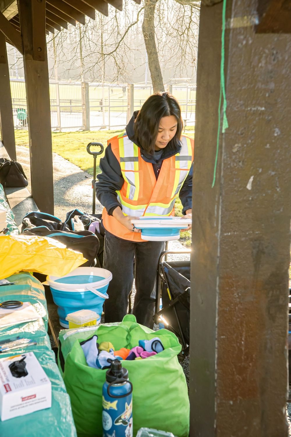 Volunteer preparing cleanup supplies