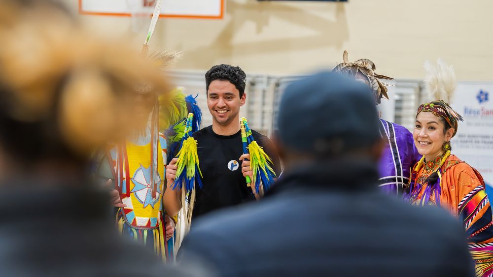 Guests and cultural performers gathering at Welcome Day